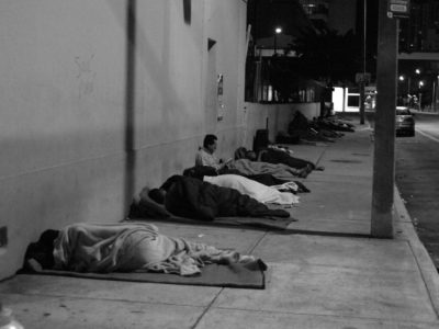 Homeless adults sleeping outside