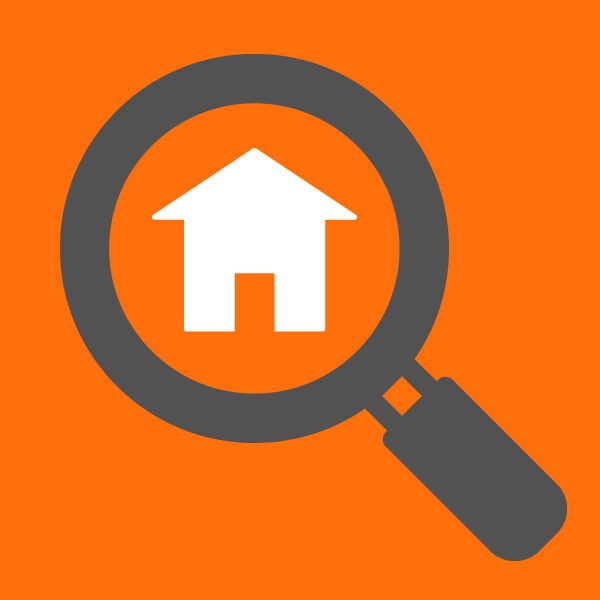 Icon of magnifying glass looking at house